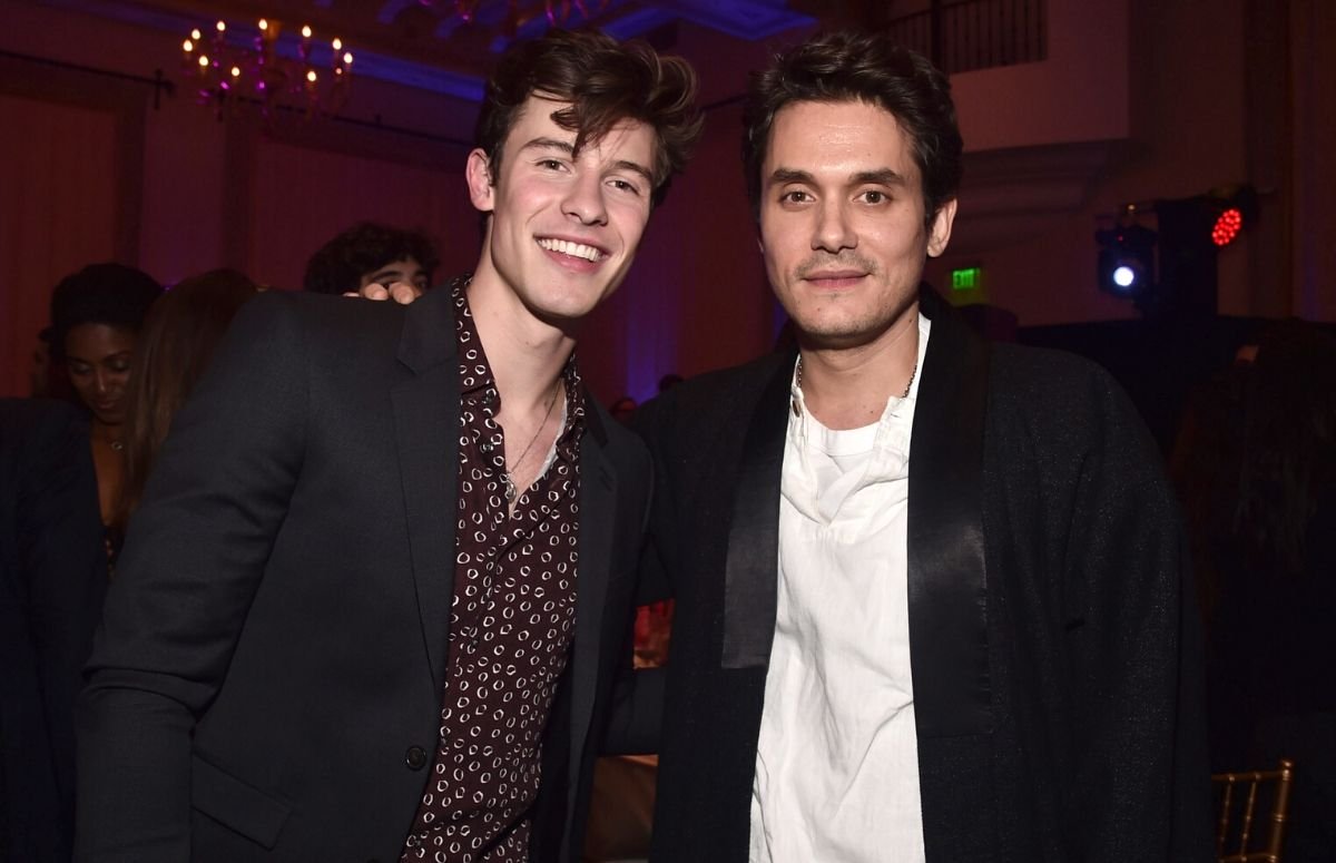 Shawn Mendes and John Mayer, both wearing black suit jackets, at the Billboard's 2018 Live Music Sum