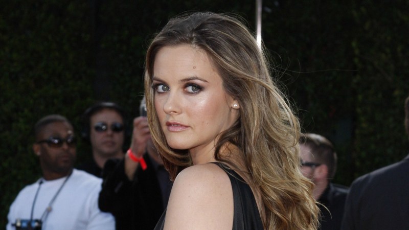 Alicia Silverstone Gives Cheeky Peek Up Her Skirt In Throwback Photo