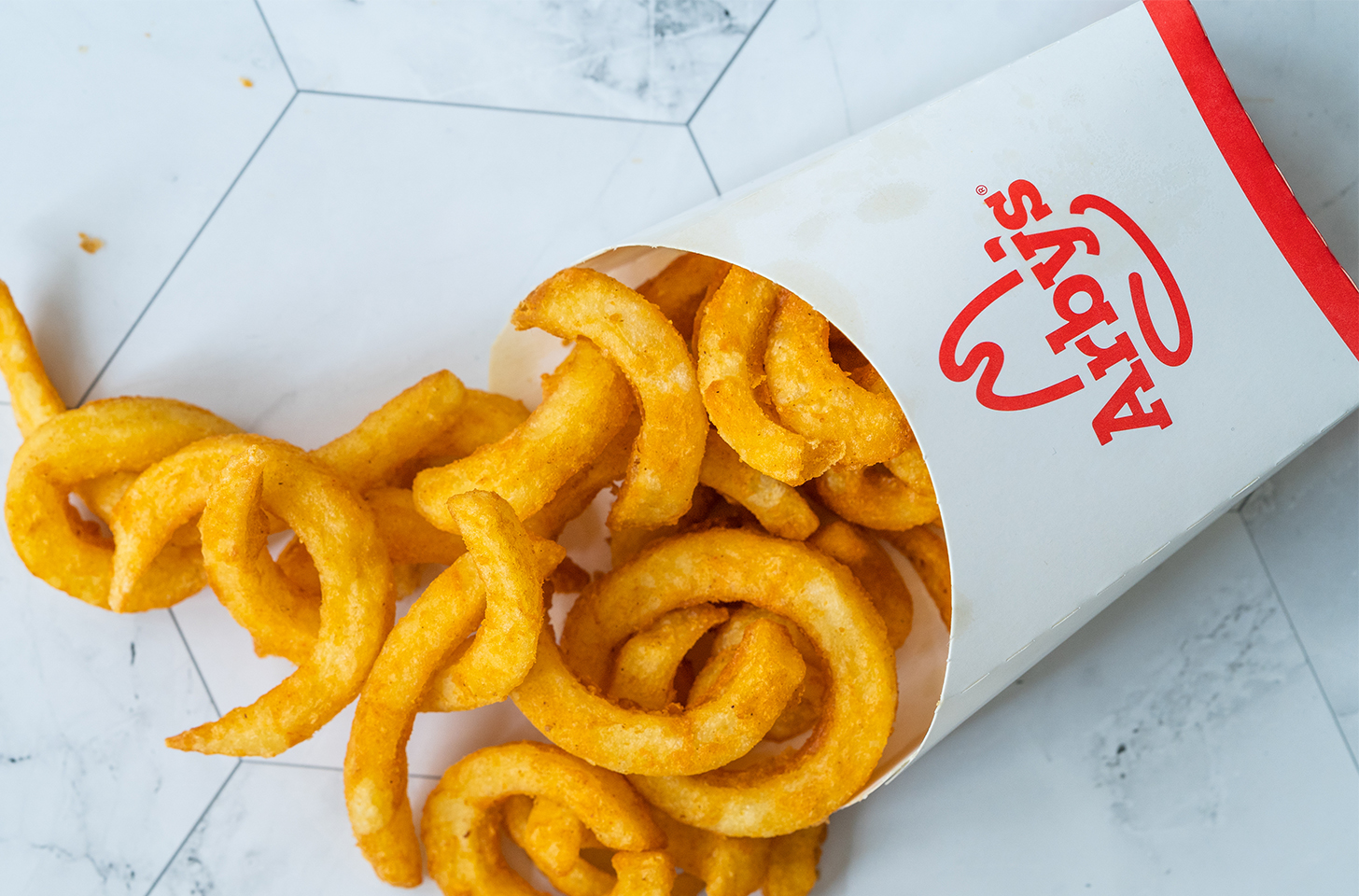 An order of Arby's curly cue fries