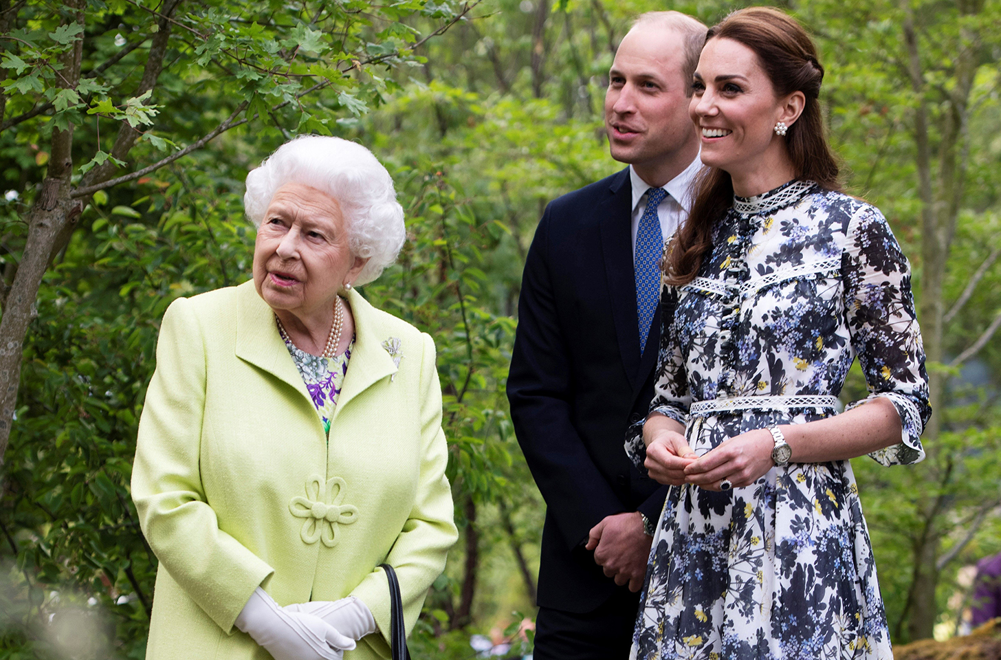 Queen Elizabeth on the left, talking to Prince William and Kate Middleton