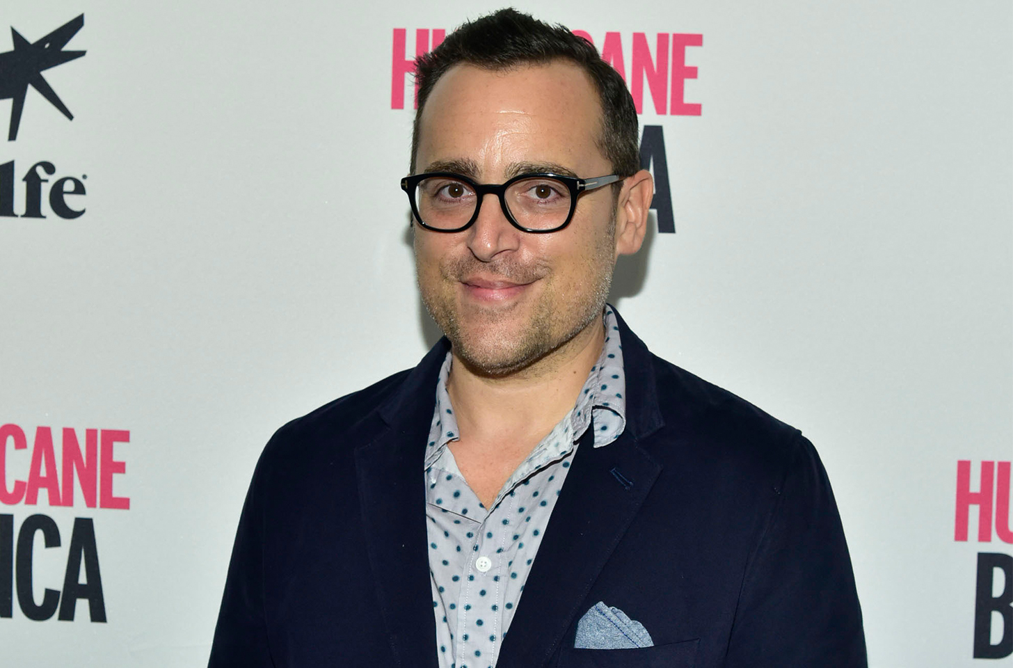 Paul Marcarelli Smiling at a red carpet event.