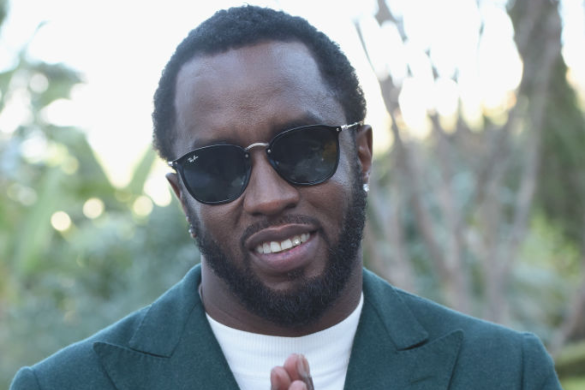 sean-diddy-combs-grins-while-smoking-and-drinking-on-private-dock-after-federal-raids