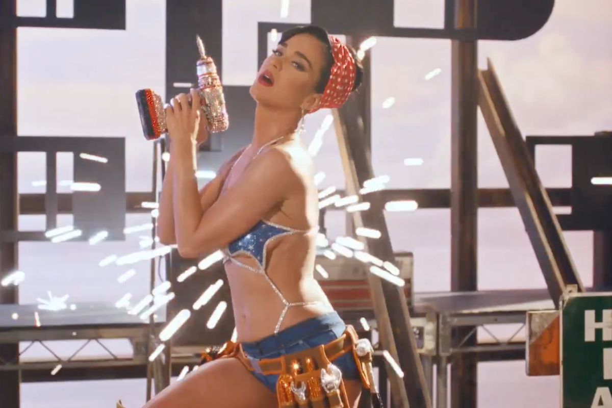 katy-perry-rocks-risque-rosie-the-riveter-cosplay-in-womans-world-teaser