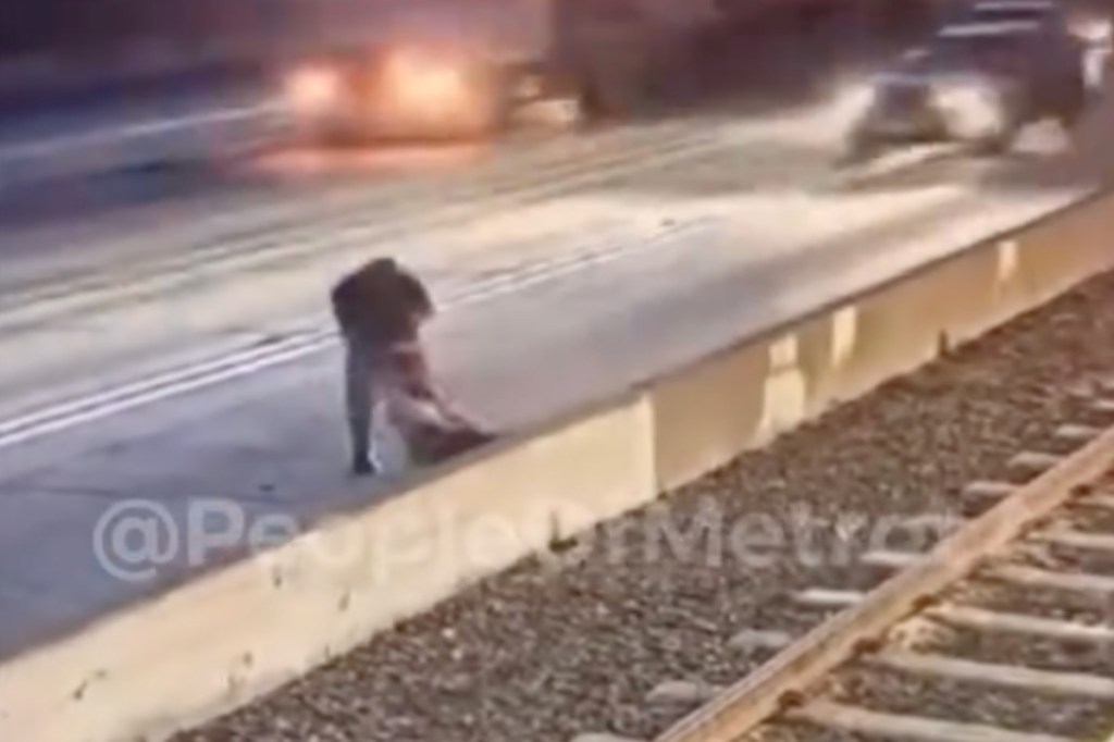 man-attacks-woman-attempts-to-drag-her-into-traffic-in-horrifying-video