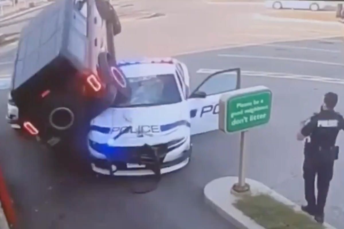 man-drives-car-onto-police-vehicle-in-fast-food-drive-thru-in-wild-video