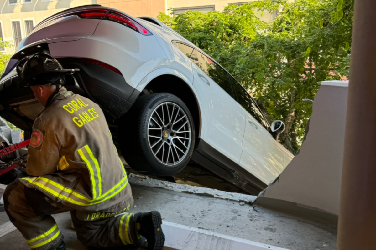 woman-crashes-through-parking-garage-suv-left-hanging-from-3rd-story-in-wild-video