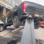 furious-driver-speeds-off-in-stolen-tow-truck-with-his-vehicle-attached-in-wild-video