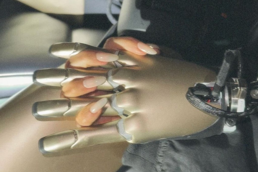 kim-kardashian-holds-hands-with-tesla-robot-in-strange-photo-shoot-hands