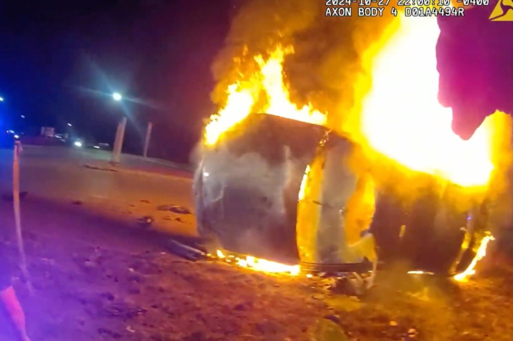 officer-smashes-through-windshield-saves-woman-just-seconds-before-car-catches-fire