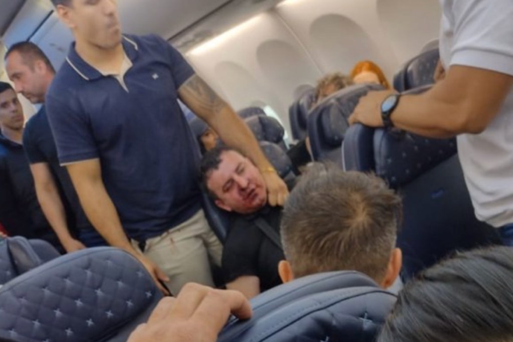 passenger-left-beaten-and-bloody-after-opening-planes-emergency-door-during-flight