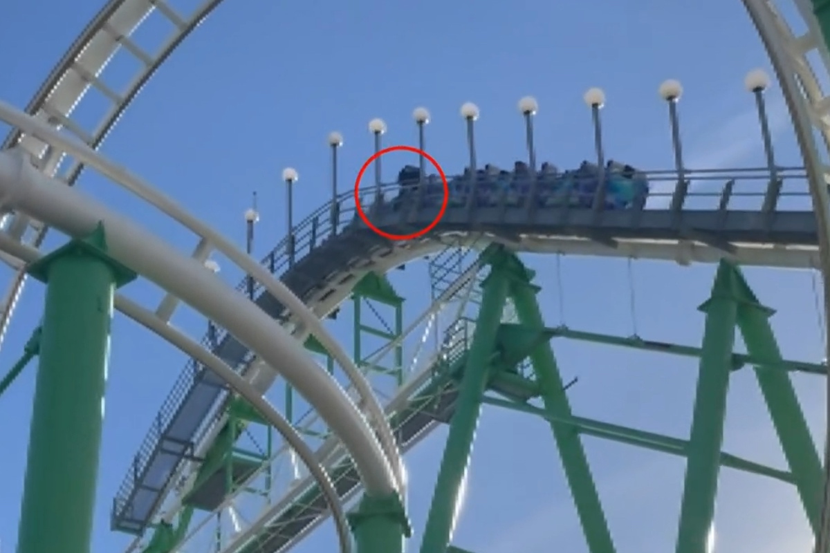 man-climbs-out-of-moving-roller-coaster-in-terrifying-video